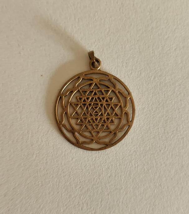 Clean lines. Infinite geometry. Embrace the beauty of simplicity with this solid brass Flower of Life pendant. Unlike our woven versions, this piece lets the ancient sacred geometry shine on its own. Crafted from high-quality antique bronze, it features