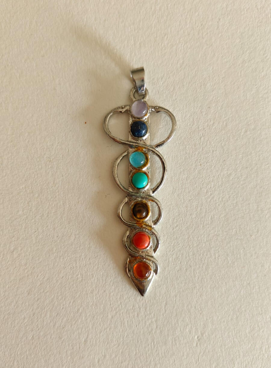 7 Chakra Pendant Necklace - Spiritual Healing Crystal Jewelry for Yoga & Meditation 100.00 dh🧘♀️✨ Balance your energy and align your soul with this beautiful 7 Chakra Pendant Necklace. Featuring a stunning spiral design, this necklace showcases the seven chakra colors with vibrant, semi-polished stones. From the root chakra to the crown, each stone is